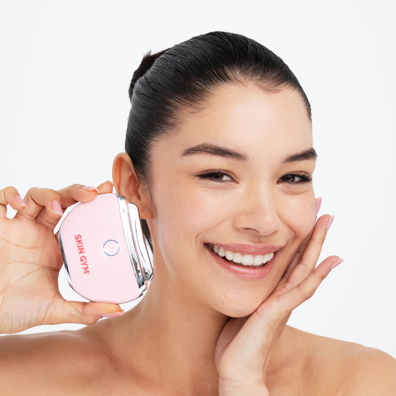 LED Therapy Gua Sha Facial Tool used by a Woman