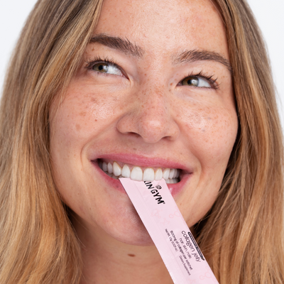 Woman using collagen jelly stick